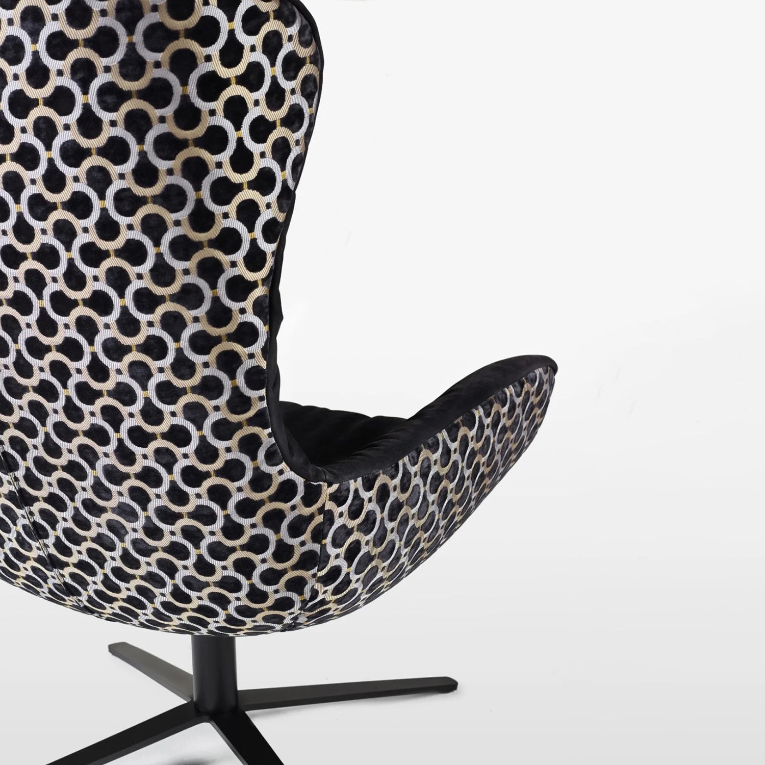 freifrau | leya wingback chair | x-base frame with tilt | cayenne ebony (black) leather + dedar scarabeo